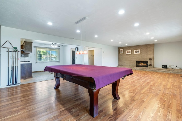 6154 E Alta Ave, Fresno, CA 93727 - playroom featuring recessed lighting, billiards, wood finished floors, and a fireplace