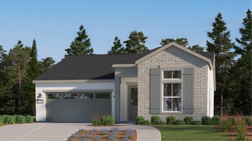 1721 Pacific Rd S Unit 82, Madera, CA 93636 - view of front facade with concrete driveway, a garage, a front yard, and brick siding