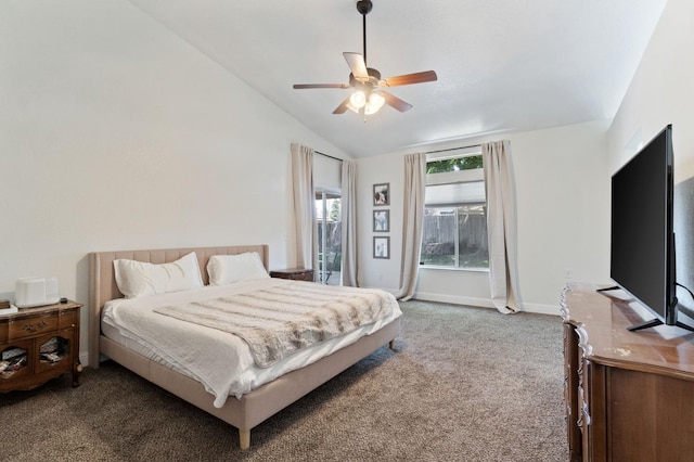 carpeted bedroom with a ceiling fan and vaulted ceiling