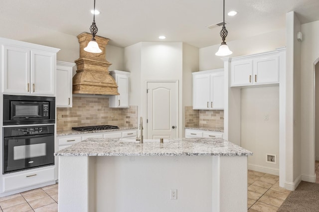 5534 N La Ventana Ave, Fresno, CA 93723 - kitchen with a sink, black appliances, and white cabinetry