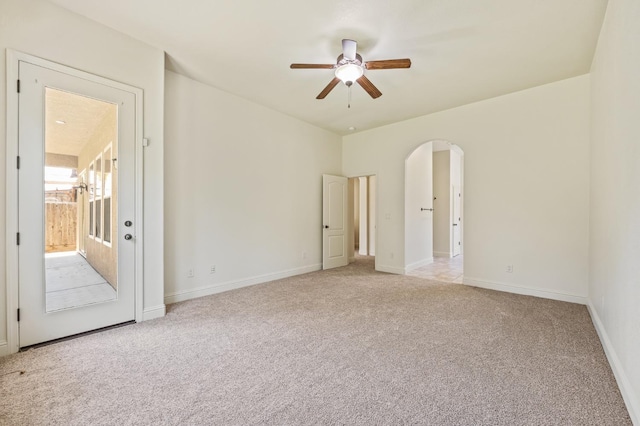 5534 N La Ventana Ave, Fresno, CA 93723 - unfurnished room featuring baseboards, ceiling fan, light carpet, and arched walkways