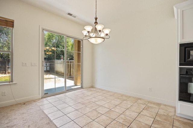 5534 N La Ventana Ave, Fresno, CA 93723 - unfurnished dining area with visible vents, baseboards, light tile patterned floors, and a chandelier