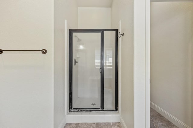 5534 N La Ventana Ave, Fresno, CA 93723 - bathroom with baseboards and a stall shower