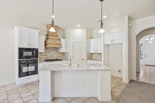 5534 N La Ventana Ave, Fresno, CA 93723 - kitchen featuring arched walkways, white cabinetry, decorative backsplash, light tile patterned floors, and black appliances