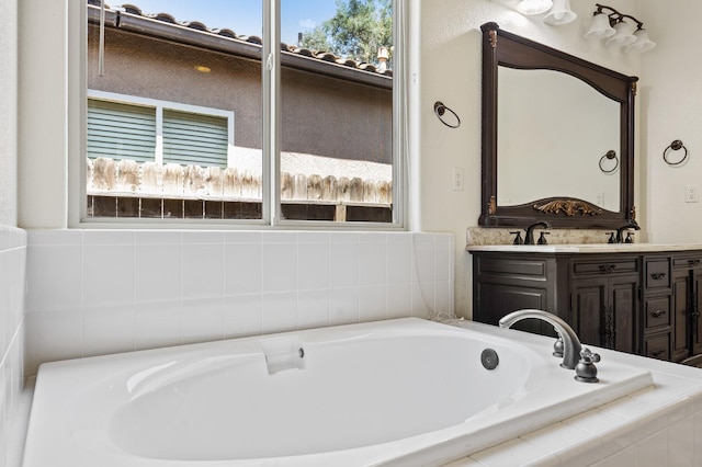 5534 N La Ventana Ave, Fresno, CA 93723 - bathroom featuring double vanity and a bath