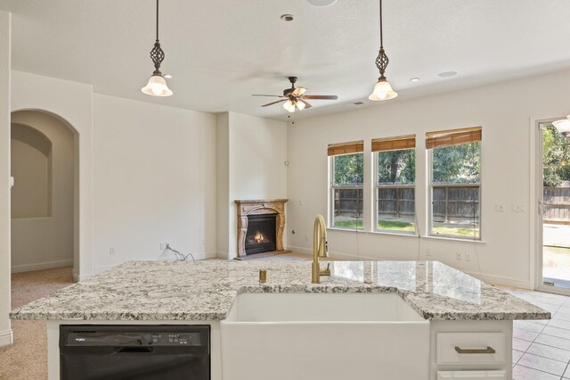 5534 N La Ventana Ave, Fresno, CA 93723 - kitchen with a sink, hanging light fixtures, black dishwasher, and open floor plan