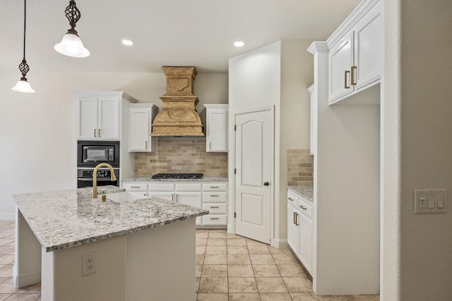 5534 N La Ventana Ave, Fresno, CA 93723 - kitchen with custom exhaust hood, black microwave, oven, a sink, and backsplash