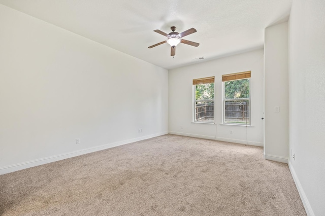 5534 N La Ventana Ave, Fresno, CA 93723 - empty room with baseboards, ceiling fan, light carpet, and visible vents
