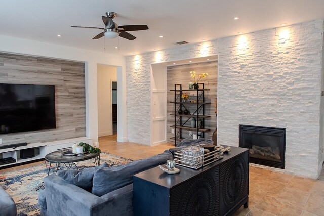 3107 Indianapolis Ave, Clovis, CA 93619 - living area with ceiling fan, a stone fireplace, and recessed lighting