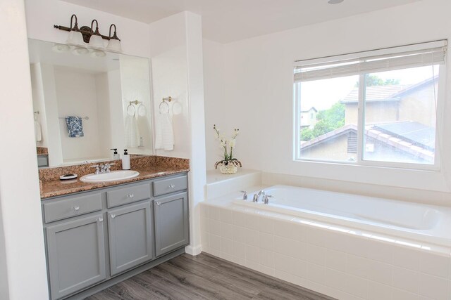 3107 Indianapolis Ave, Clovis, CA 93619 - full bathroom with a bath, vanity, and wood finished floors