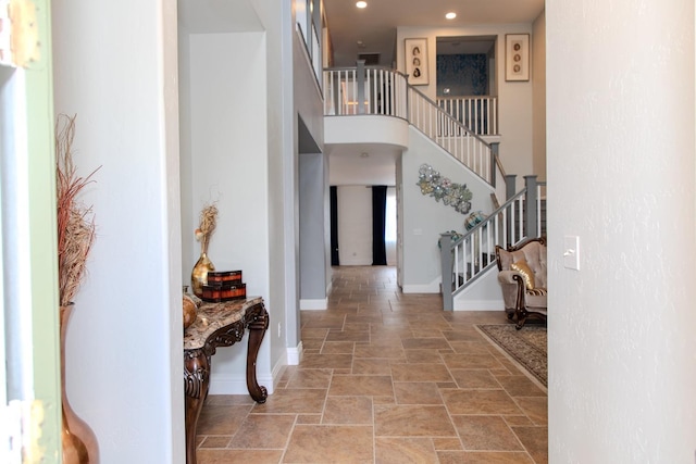 3107 Indianapolis Ave, Clovis, CA 93619 - foyer entrance featuring light stone finish flooring, stairway, recessed lighting, and a high ceiling