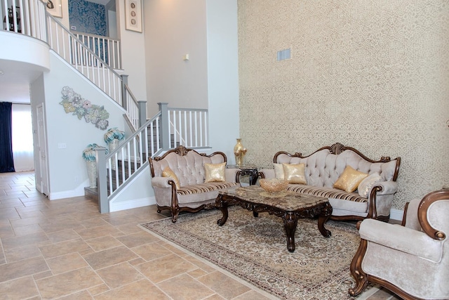 3107 Indianapolis Ave, Clovis, CA 93619 - living room with a high ceiling, stairs, and stone finish flooring