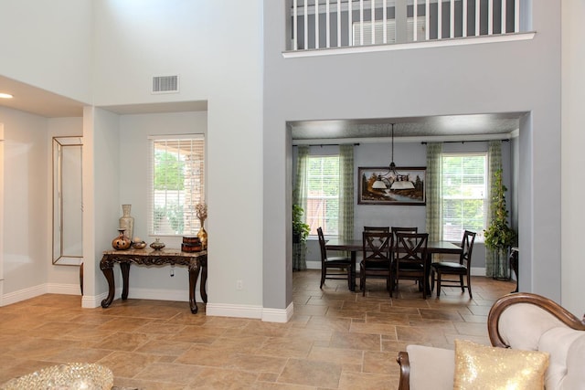 3107 Indianapolis Ave, Clovis, CA 93619 - dining room with light stone finish floors and a high ceiling