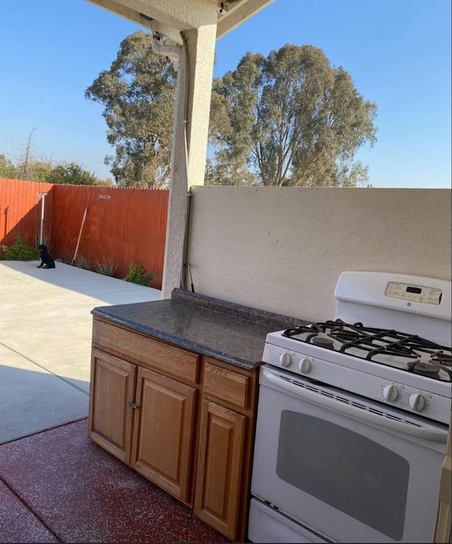 5244 W Fern Ave, Fresno, CA 93722 - view of patio with fence and a hot tub