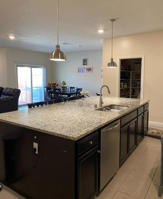 5244 W Fern Ave, Fresno, CA 93722 - kitchen featuring a sink, dishwasher, an island with sink, open floor plan, and light tile patterned floors