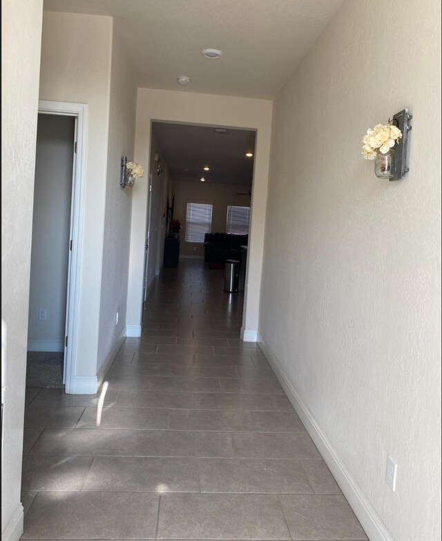 5244 W Fern Ave, Fresno, CA 93722 - corridor featuring tile patterned floors and baseboards