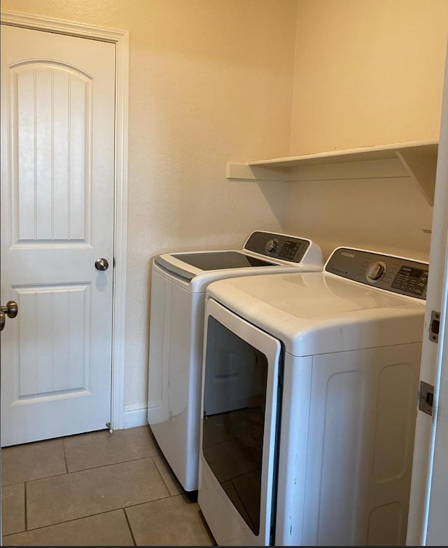 5244 W Fern Ave, Fresno, CA 93722 - laundry area featuring laundry area, light tile patterned flooring, and washer and dryer