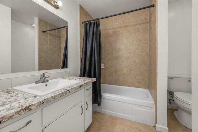 bathroom featuring tile patterned floors, shower / bath combo with shower curtain, vanity, and toilet