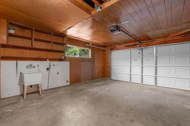 garage with a sink, wooden ceiling, and a garage door opener