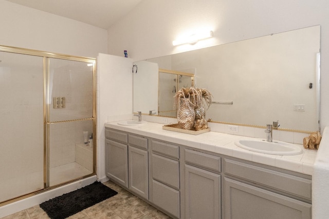 6577 E Kerckhoff Ave, Fresno, CA 93727 - full bath featuring double vanity, a sink, and a stall shower