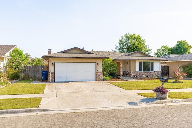 single story home featuring fence, an attached garage, a front lawn, brick siding, and driveway