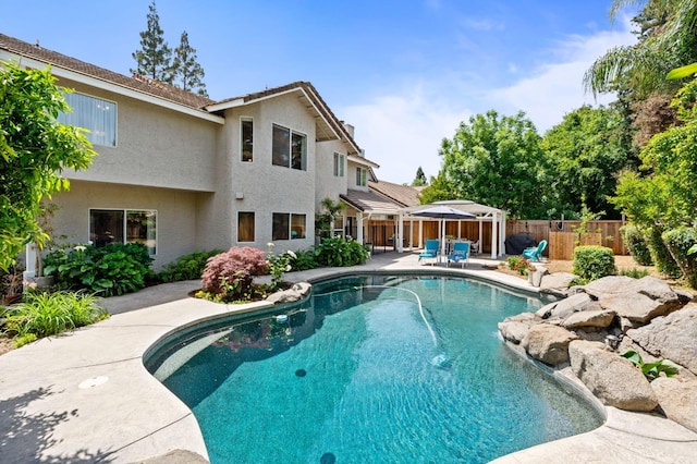 view of pool featuring a fenced backyard, a fenced in pool, and a patio area