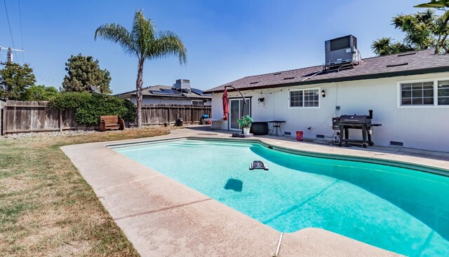 927 W Pico, Clovis, CA 93612 - view of pool with a fenced backyard, a fenced in pool, central AC unit, a patio area, and a lawn