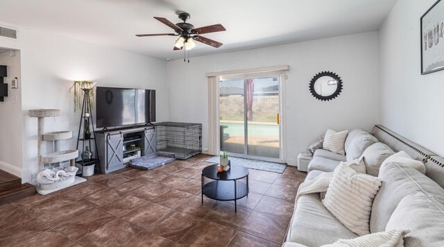 927 W Pico, Clovis, CA 93612 - living area featuring a ceiling fan, baseboards, and visible vents
