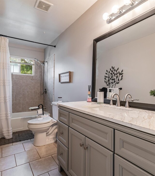 927 W Pico, Clovis, CA 93612 - full bath featuring visible vents, vanity, toilet, tile patterned floors, and shower / bath combo