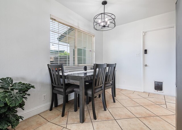 927 W Pico, Clovis, CA 93612 - dining space featuring baseboards, light tile patterned floors, and a notable chandelier