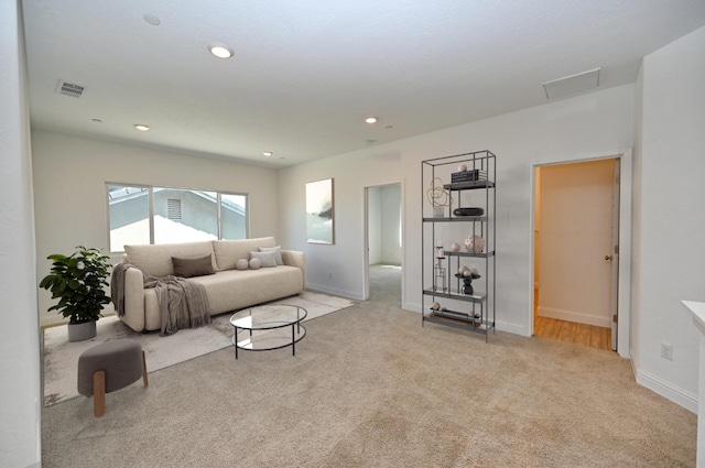 living area with recessed lighting, attic access, baseboards, carpet flooring, and visible vents