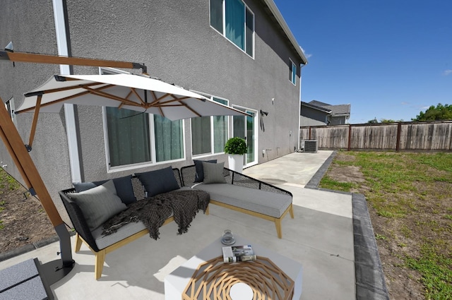 view of patio / terrace with an outdoor hangout area, a fenced backyard, and central AC