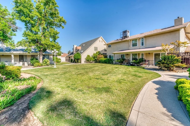 301 W Paul Ave, Clovis, CA 93612 - view of yard featuring covered porch and central AC unit