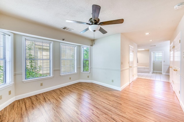 301 W Paul Ave, Clovis, CA 93612 - spare room with ceiling fan, light wood-style flooring, recessed lighting, baseboards, and visible vents