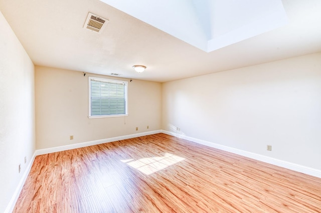 301 W Paul Ave, Clovis, CA 93612 - unfurnished room with baseboards, wood finished floors, and visible vents