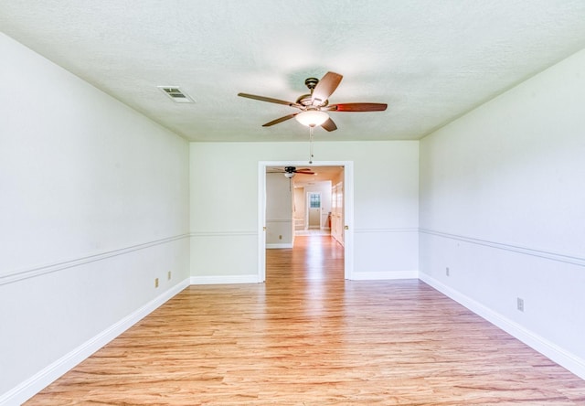 301 W Paul Ave, Clovis, CA 93612 - spare room with a ceiling fan, a textured ceiling, visible vents, light wood-type flooring, and baseboards