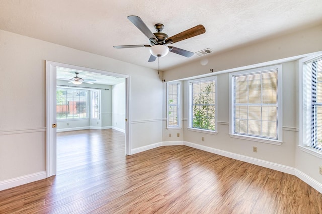 301 W Paul Ave, Clovis, CA 93612 - empty room with light wood-style floors, a ceiling fan, baseboards, and visible vents