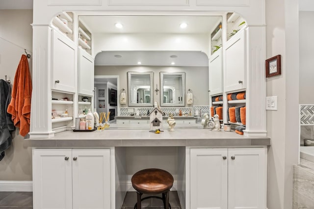 bathroom with tasteful backsplash