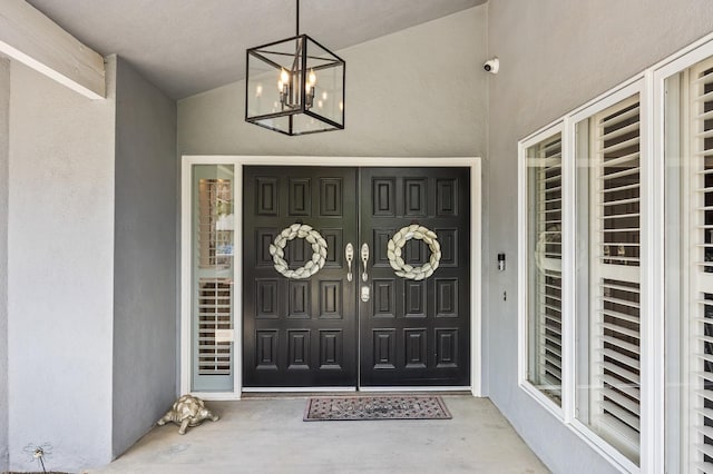 view of exterior entry featuring stucco siding