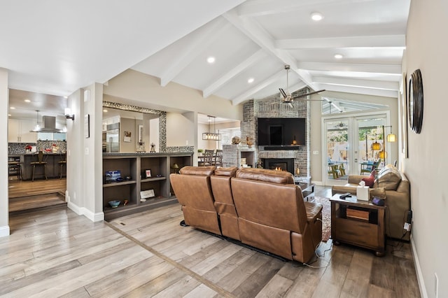 2315 W Celeste Ave, Fresno, CA 93711 - living room with light wood-type flooring, a fireplace, baseboards, a ceiling fan, and recessed lighting