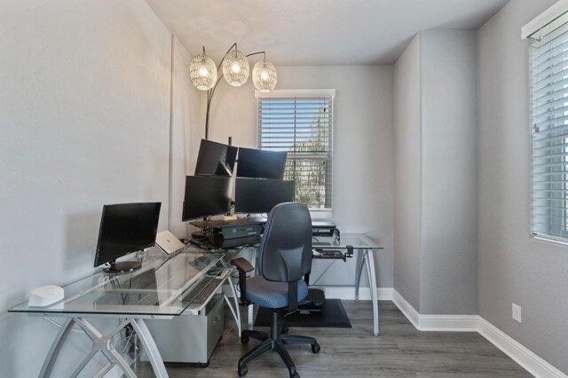 office area featuring baseboards and wood finished floors