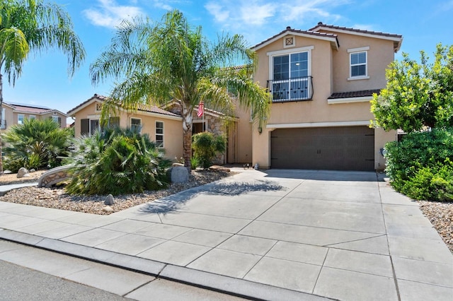 3772 Wrenwood Ave, Clovis, CA 93619 - view of front of home featuring concrete driveway, stucco siding, a tiled roof, and an attached garage