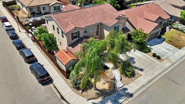 birds eye view of property with a residential view