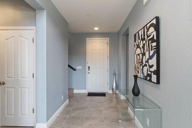 interior space with stairway, baseboards, and recessed lighting