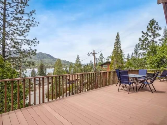 56406 Marina View Way, Bass Lake, CA 93604 - wooden deck featuring a mountain view and outdoor dining space