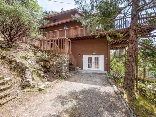 56406 Marina View Way, Bass Lake, CA 93604 - back of property with french doors, stairway, and a deck