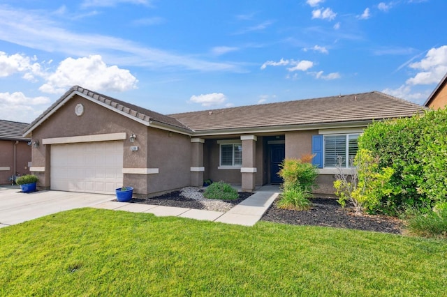 ranch-style house with concrete driveway, a garage, a front yard, and stucco siding
