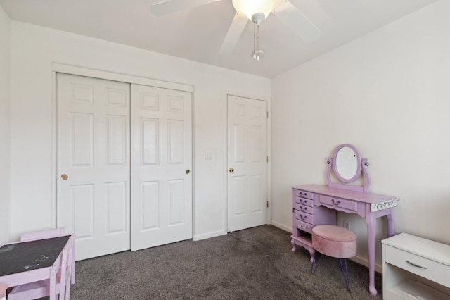 carpeted bedroom with a closet and ceiling fan