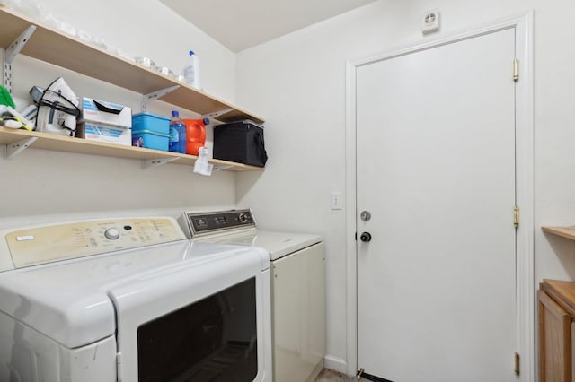 laundry room with laundry area and washing machine and clothes dryer
