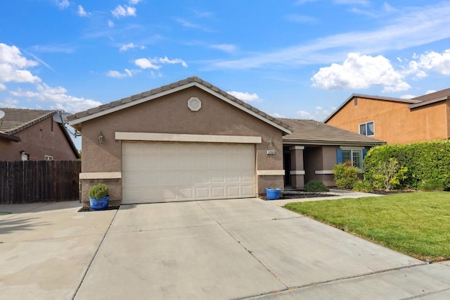 ranch-style house featuring fence, an attached garage, stucco siding, a front yard, and driveway